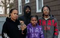 From left to right: Jasmine Stradford; her partner, Tiberious Moses; and two of their children, Taylor and De’Vante. The Broome County, New York, Department of Social Services cycled the family through four roadside hotels over three months. 
(Michelle Gabel / ProPublica)