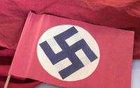 A swastika flag displayed in a showcase during the press preview at the permanent exhibition of former Nazi concentration camp Buchenwald near Weimar, central Germany, Wednesday, April 13, 2016. 
(Jens Meyer / AP Photo)