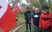 In this Oct. 30, 2013 photo, Craig Cobb (right) with supporters Mike Spence, of Goodrich, Albert Borgmann, of Minot, and Kynan Dutton, of Oregon, who arrived to help him create an all white community in Leith, N.D.
 (Lauren Donovan / The Bismarck Tribune via AP)