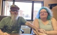 Bruce and Nova Jewett, who are experiencing homelessness, sit at the Hilltop Inn in Berlin, Vt., on Wednesday, Sept. 18, 2024, where they have been living and will have to leave by Oct. 1, 2024. 
(Lisa Rathke / AP Photo)