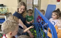 Rylee Monn plays with children in her class at a child care center in Lexington, Ky., March 13, 2024. A 2025 poll from advocacy group First Five Years Fund found that 4 out of 5 rural Americans “say the ability of working parents to find and afford quality child care is either in a ‘state of crisis’ or ‘a major problem.’”
(Dylan Lovan / AP Photo)