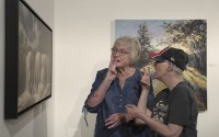 Janith Farnham signs "water" while she and her daughter, Jacque, look at an artwork of a waterfall at the Visual Arts Center at the Washington Pavilion in Sioux Falls, S.D., on May 20, 2025. 
(Shelby Lum / AP Photo)
