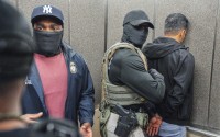 Immigration and Customs Enforcement agents escort a detained immigrant into an elevator after he exited an immigration courtroom, Tuesday, June 17, 2025, in New York. 
(Olga Fedorova / AP Photo)