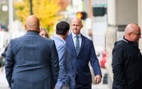 Former Alaska Airlines pilot Joseph Emerson (center) walks into U.S. District Court in Portland, Ore., Monday, Nov. 17, 2025. 
(Molly J. Smith / AP Photo)