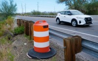 A license plate reader used by U.S. Border Patrol is hidden in a traffic cone while capturing passing vehicles on AZ Highway 85, Tuesday, Oct. 21, 2025, in Gila Bend, Ariz. 
(Ross D. Franklin / AP Photo)