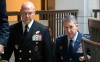 U.S. Navy Adm. Frank M. Bradley, accompanied by Gen. Dan Caine, chairman of the Joint Chiefs of Staff (right) walks to a meeting with senators on Capitol Hill, Thursday, Dec. 4, 2025, in Washington. 
(Mark Schiefelbein / AP Photo)