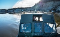 Tristen Pattee hunts with his family along the Kobuk River near Ambler, Alaska, where heavy rains have contributed to riverbank erosion Tuesday, Sept. 30, 2025. 
(Annika Hammerschlag / AP Photo)