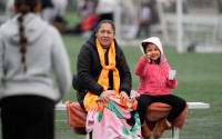 Valeria Hernandez (left) walks toward her mother Candelaria (center) and sister Itzayana (right) during a soccer tournament for immigrant and refugee girls on Sunday, March 29, 2026, in Portland, Ore. 
(Jenny Kane / AP Photo)