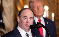 Secretary of the Navy John Phelan speaks, as President Donald Trump listens, at Trump's Mar-a-Lago club, Dec. 22, 2025, in Palm Beach, Fla. 
(Alex Brandon / AP Photo)