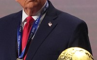 President Donald Trump stands on stage after receiving the FIFA Peace Prize during the draw for the 2026 soccer World Cup at the Kennedy Center in Washington, Dec. 5, 2025.
 (Jacquelyn Martin / AP Photo)