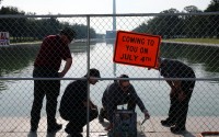 National Park Service staff test the water at the Lincoln Memorial Reflecting Pool, Tuesday, June 30, 2026, in Washington. 
(Rahmat Gul / AP Photo)