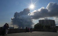 Smoke billows into the sky following Ukrainian drone strikes on warehouses of Russia's online retailer Wildberries, in St. Petersburg, Russia, Friday, July 24, 2026.
 (UGC via AP)