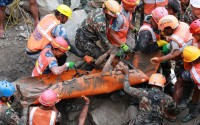 In this photo provided by the Nepal Army, soldiers rescue a worker alive from a tunnel during an ongoing operation at the Trishuli-3A hydropower project in Nepal's Rasuwa district, Friday, Sept. 4, 2026. 
(Nepal Army via AP)