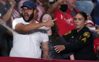 Police remove a protesters as President Donald Trump speaks at a campaign rally at the Freeman Coliseum in San Antonio, Wednesday, Oct. 7, 2026. 
(Eric Gay / AP Photo)