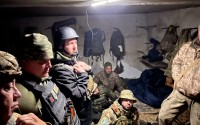 The front-line of a military group in Donetsk, Ukraine, shelters from artillery. State Sen. Tom Brewer joins them in the bottom left. 
(Courtesy of Noah Philson)
