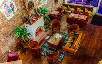Masa Luna opened in September in Omaha's Little Bohemia to much buzz, reviewer Sarah Baker Hansen writes. The restaurant has a singular retro-fun look with a “your grandparents’ basement but cooler” vibe, she says. 
(Joshua Foo / Flatwater Free Press)