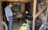 The interior of the Mayhew Cabin has furnishings from the era of settlement in Nebraska. 
(Paul Hammel / Nebraska Examiner)