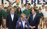 Nebraska Gov. Jim Pillen talking in front of U.S. Reps. Adrian Smith and Mike Flood at St. Teresa Catholic School in Lincoln on Sep. 29, 2025. 
(Juan Salinas II / Nebraska Examiner)