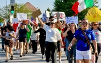 About 400 people turned out to demonstrate against ICE enforcement in Omaha at a rally at 33rd and L Streets.
 (Cindy Gonzalez / Nebraska Examiner)