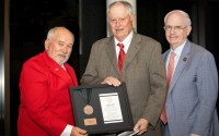 Former Nebraska volleyball coach Terry Pettit accepts the Regents Award from NU Regent Paul Kenney (left) and NU President Jeffrey Gold (right). 
(Courtesy of University of Nebraska)