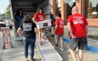 Last fall, teachers and other backers of Support Our Schools wheel out boxes of voter-signed petitions seeking to repeal the Opportunity Scholarships Act on the 2024 ballot. The vote would be cancelled if a new Opportunity Scholarship Act is passed by the 2024 Legislature, a move some have called “underhanded.” 
(Aaron Sanderford / Nebraska Examiner)