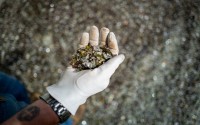 The glass, ground up in a sand-like texture, can be mixed with asphalt and concrete for road construction, according to Nathan Lund with the city. 
(Abiola Kosoko / Flatwater Free Press)