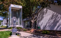 The pay phone outside the Pierce Telephone Co. in Pierce wasn’t working when someone tried to use it, so Jeff Kesting, the phone company’s plant manager, fixed the problem so the phone would work again. 
(Darin Epperly / Flatwater Free Press)