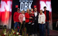 Dani Busboom Kelly and her family on stage at an official introductory event Feb. 6 in the Devaney Center. Busboom Kelly was a standout player for the Huskers in the 2000s before launching into her coaching career. 
(Courtesy of Nebraska Athletics)