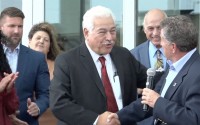 Developer Paul Younes shakes hands with then-Mayor Stan Clouse at a 2022 event in Kearney. “Paul got to where he’s at by hard work, not by cheating the system,” said Clouse, now a state senator. His comments came following news that the federal government wants Younes to testify in an investigation looking at potential fraud. 
(Photo courtesy of News Channel Nebraska)