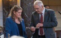 State Sen. Rob Clements of Elmwood (right)talks with State Sen. Carolyn Bosn of Lincoln on the floor of the Nebraska Legislature on Feb. 27, 2024. 
(Zach Wendling / Nebraska Examiner)