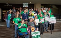 Advocates for medical cannabis join together before a public hearing at the Nebraska State Office Building in Lincoln, Nebraska, on state-drafted regulations for the new medicine approved by Nebraska voters in November 2024, Oct. 15, 2025. 
(Zach Wendling / Nebraska Examiner)