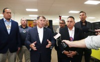 U.S. Sen. Mike Rounds (center) and tribal leaders speak to the media after a public safety roundtable on Aug. 14, 2024, in Wagner, South Dakota. With Rounds, from left, are Cheyenne River Chairman Ryman LeBeau, Lower Brule Chairman Clyde Estes, Sisseton Wahpeton Secretary Curtis Bissonette, Wayne Boyd of Rosebud Sioux Tribe, Yankton Chairman Robert Flying Hawk, Oglala President Frank Star Comes out and Crow Creek Chairman Peter Lengkeek.
 (Photo by Makenzie Huber / South Dakota Searchlight)