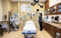 Kristin Salmon, RN, ER trauma coordinator, prepares a trauma bay at Pender Community Hospital. Across the state and country, it has become increasingly difficult for hospitals like the one in Pender to keep doors open. 
(Rebecca S. Gratz / Flatwater Free Press)
