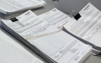 Petition pages reviewed by local county election officials and returned to the Nebraska Secretary of State’s Office sit in the office for public inspection at the office’s Elections Division in downtown Lincoln on Aug. 24, 2026. 
(Zach Wendling / Nebraska Examiner)