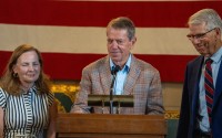Nebraska Gov. Jim Pillen (center) leads a news conference with First Lady Suzanne Pillen and Lt. Gov. Joe Kelly on June 15, 2026. 
(Zach Wendling / Nebraska Examiner)
