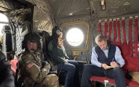 Nebraska Gov. Jim Pillen (right) and U.S. Secretary of Agriculture Brooke Rollins (center) survey wildfire damage over Nebraska on March 23, 2026. 
(Courtesy of the Nebraska Governor’s Office)