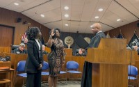 Tamara T. Mosby being sworn in by the Honorable Derek Vaughn. Her daughter Brooklyn (left) had the best seat in the house. 
(Courtesy of Dr. Montegut)