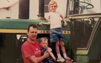 Tim Yerkey with his daughters Emma (baby), Claire (on top step), and Allison Yerkey (on bottom step) at their family farm. 
(Photo courtesy of Emma Yerkey)