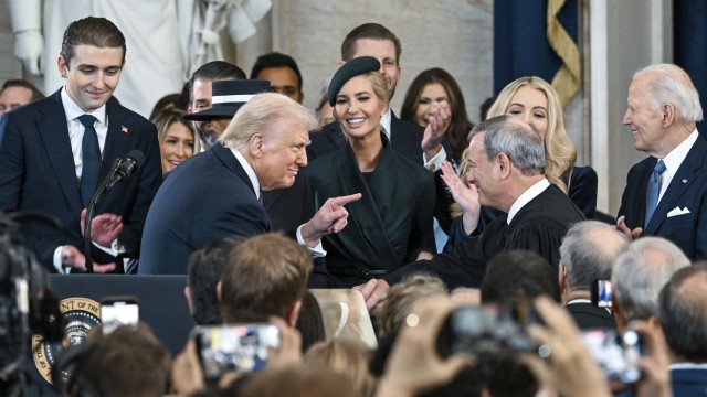 President Donald Trump, left, points to Supreme Court Chief Justice John Roberts after taking the oath of office during the 60th Presidential Inauguration in the Rotunda of the U.S. Capitol in Washington, Monday, Jan. 20, 2025. 
(Kenny Holston / The New York Times via AP)