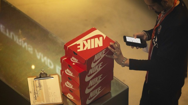 An employee holds Nike shoe boxes at the Nike store on the 5th Avenue, Monday, April 7, 2025, in New York.
(Yuki Iwamura / AP Photo)
