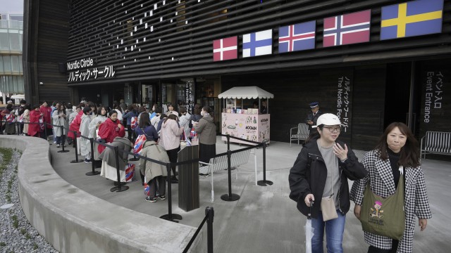 People wait in line to enter the Nordic pavilion, representing Denmark, Finland, Iceland, Norway and Sweden, on the opening day of the Expo 2025 in Osaka, central Japan, Sunday, April 13, 2025. 
(Hiro Komae / AP Photo)