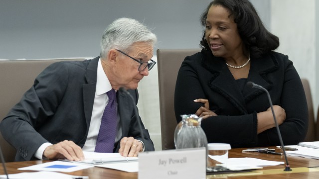 Federal Reserve Chairman Jerome Powell (left)talks with Board of Governors member Lisa Cook (right) during an open meeting of the Board of Governors at the Federal Reserve, June 25, 2025, in Washington. 
(Mark Schiefelbein / AP Photo)