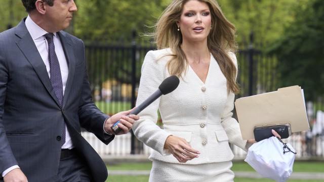 Lindsey Halligan, special assistant to the president, speaks with a reporter outside of the White House, Wednesday, Aug. 20, 2025, in Washington. 
(Jacquelyn Martin / AP Photo)