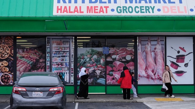 Women and children exit an Afghan grocery store in North Highlands, Calif., Friday, Dec. 5, 2025.
(Godofredo A. Vásquez / AP Photo)