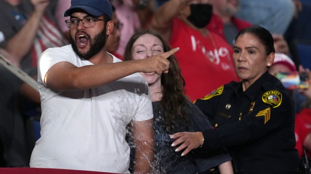 Police remove a protesters as President Donald Trump speaks at a campaign rally at the Freeman Coliseum in San Antonio, Wednesday, Oct. 7, 2026.
(Eric Gay / AP Photo)