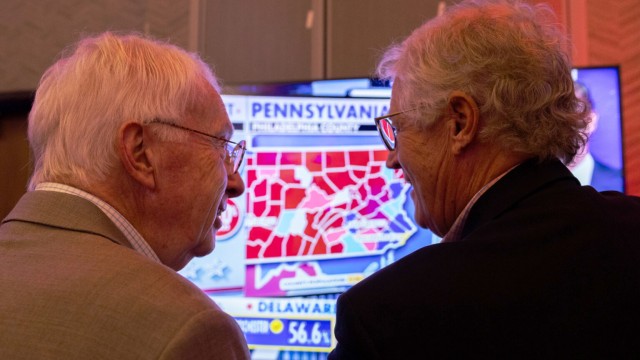 State Sen. Merv Riepe of Ralston and Fletcher Reel of Omaha discuss election results for Pennsylvania at the Nebraska GOP watch party in Bellevue on Nov. 5, 2024. 
(Marissa Lindemann / Nebraska News Service)
