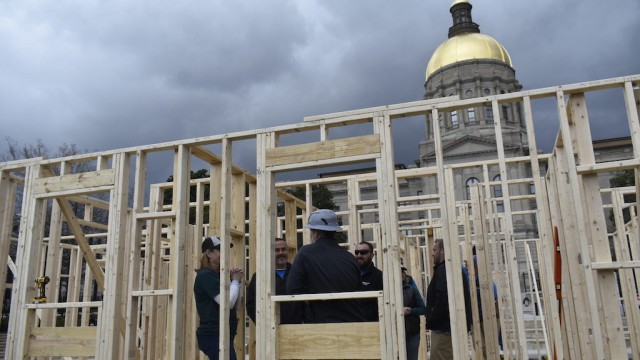 A coalition of Georgia housing rights organizations build a makeshift home outside the state Capitol in March to promote a tax credit bill that would save money on home construction expenses for nonprofits. Mayors across the country say the housing crisis has become one of their most important challenges.
(Ross Williams / Georgia Recorder)