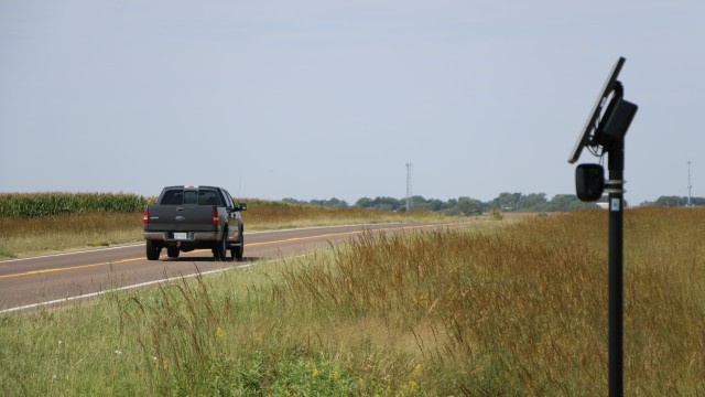 A pickup passes by the Flock camera located along Highway 136, near the Harlan County-Franklin County line east of Republican City. 
(Brian Neben / Flatwater Free Press)