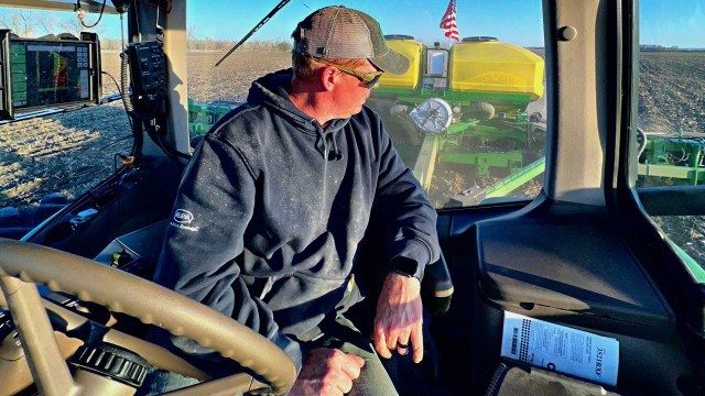 Quentin Connealy looks back at his crops from the seat of his tractor. Connealy, who has been farming full time for the past 15 years, said he has had to deal with increasingly extreme weather. 
(Photo courtesy of Quentin Connealy via Flatwater Free Press) 
