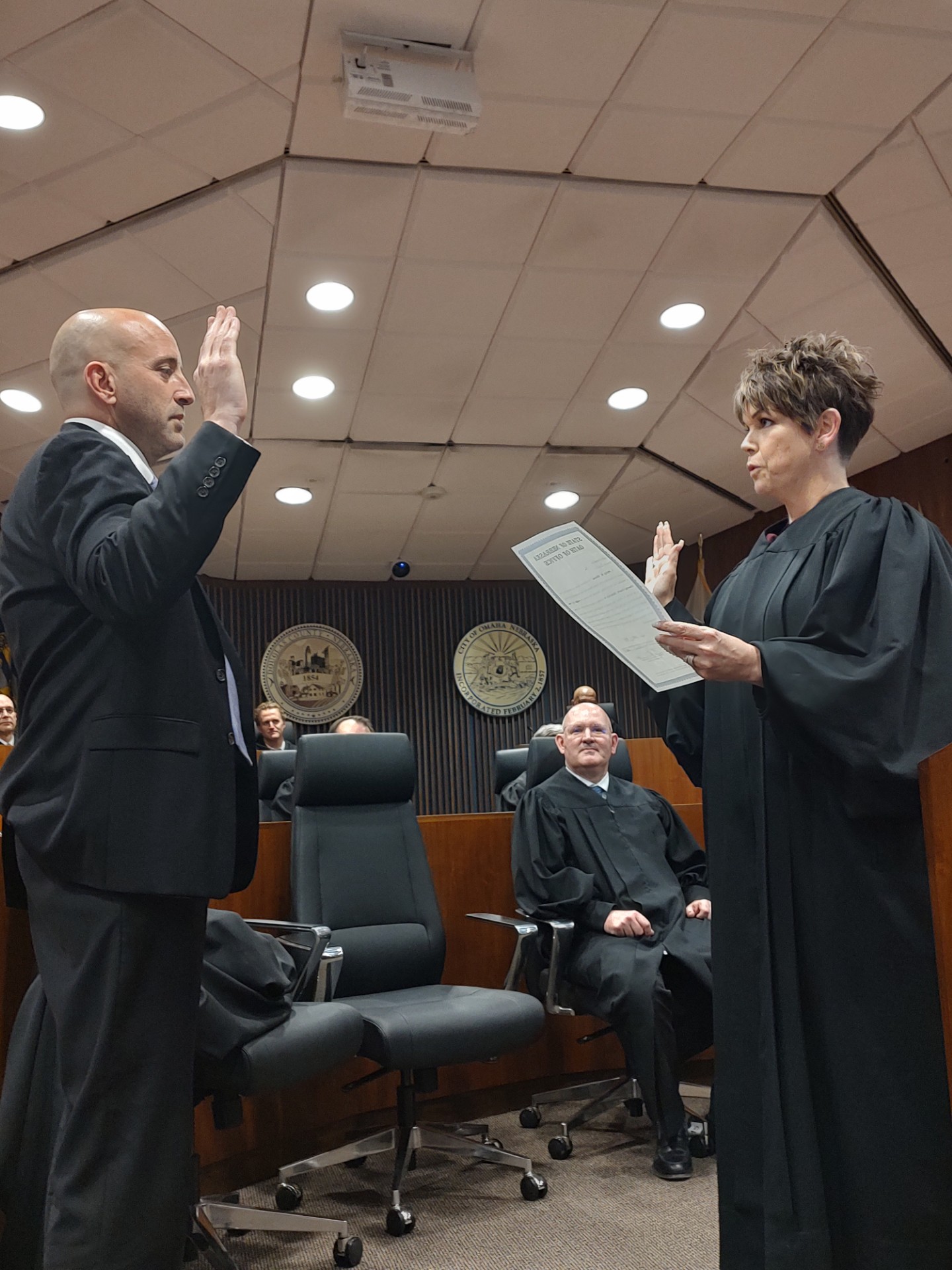 The Honorable Marcela A. Keim administers Philip Keenan Kleine&#039;s Oath of Office in a room full of smiling well-wishers Friday, May 2, 2025.<br />(Austin Petak / The Daily Record)
